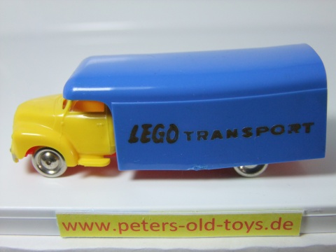1257-16 Ausführung international, Aufbau mit Bedruckung " LEGO TRANSPORT " in gold, Blinker unter den Scheinwerfern, Fahrerhaus:gelb, Aufbau:blau, Chassis: rot