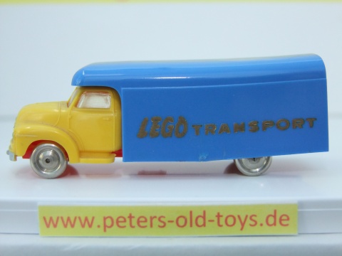 1257-07 Ausführung international, Aufbau mit Bedruckung " LEGO TRANSPORT " in gold, Blinker auf den Kotflügeln, Fahrerhaus:gelb, Aufbau:blau, Chassis: rot