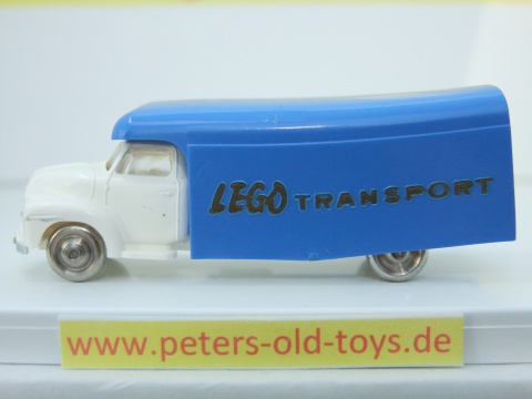 1257-06 Ausführung international, Aufbau mit Bedruckung " LEGO TRANSPORT " in gold, Blinker auf den Kotflügeln, Fahrerhaus:weiss, Aufbau:blau, Chassis: weiss