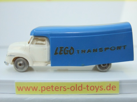 1257-05 Ausführung international, Aufbau mit Bedruckung " LEGO TRANSPORT " in gold, Blinker auf den Kotflügeln, Fahrerhaus:weiss, Aufbau:blau, Chassis: weiss