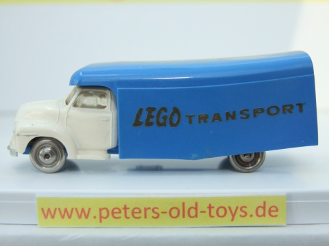 1257-03 Ausführung international, Aufbau mit Bedruckung " LEGO TRANSPORT " in gold, Blinker auf den Kotflügeln, Fahrerhaus:weiss, Aufbau:blau, Chassis: blau