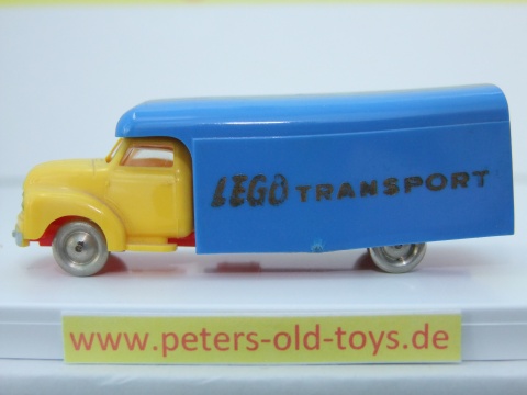 1257-10 Ausführung international, Aufbau mit Bedruckung " LEGO TRANSPORT " in gold, Blinker unter den Scheinwerfern, Fahrerhaus:gelb, Aufbau:blau, Chassis: rot