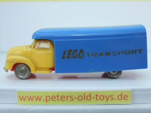 1257-08 Ausführung international, Aufbau mit Bedruckung " LEGO TRANSPORT " in gold, Blinker auf den Kotflügeln, Fahrerhaus:gelb, Aufbau:blau, Chassis: rot