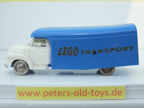 1257-04 Ausführung international, Aufbau mit Bedruckung " LEGO TRANSPORT " in gold, Blinker auf den Kotflügeln, Fahrerhaus:weiss, Aufbau:blau, Chassis: blau